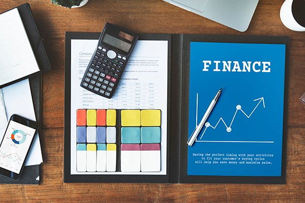 Finance book with a calculator pic