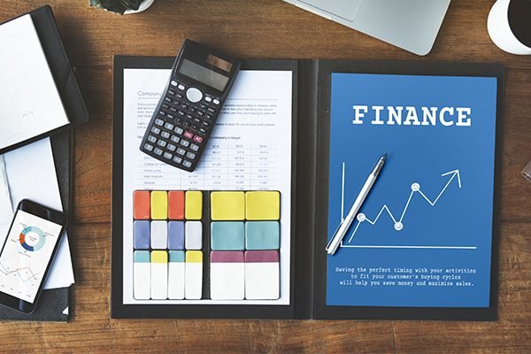 Finance book with a calculator pic