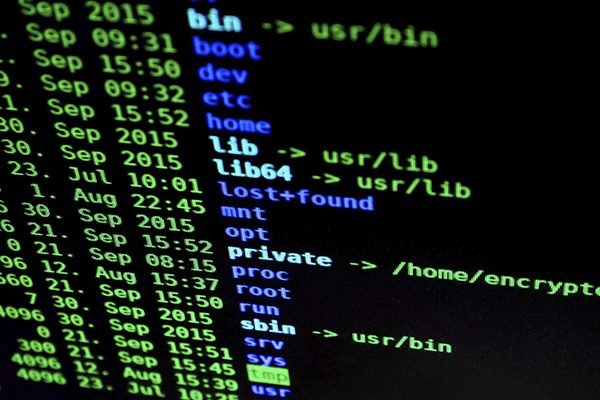 A computer screen with black screen and written codes
